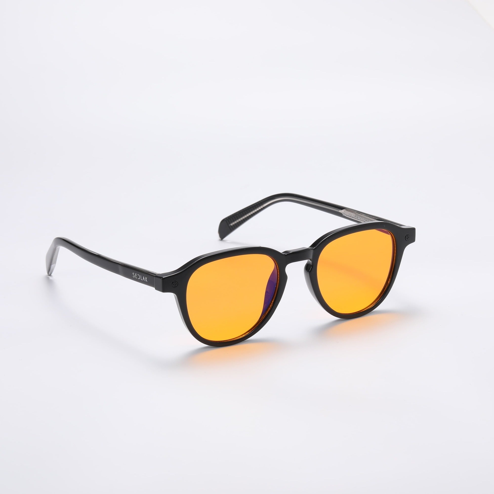 Black square-framed sunglasses with orange lenses on a white background.